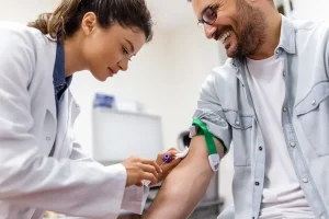 phlebotomy tech getting patient ready for drawing blood