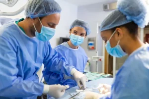 surgical tech helping doctor in operation