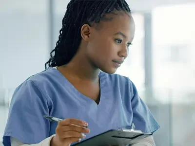 young_black_woman_health_unit_coordinator_holding_clipboard-400x300-1